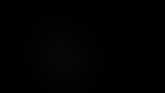 Soft circular white light pulses emerge slowly from deep black background in this mesmerizing abstract digital animation motion clip designed for high quality creative visual backgrounds and professio