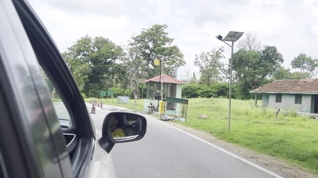 Bandipur Tiger Reserve entrance arch in Karnataka India with tiger sculpture, forest trees and tribal wildlife statue, showcasing famous national park gateway, safari tourism and conservation landmark