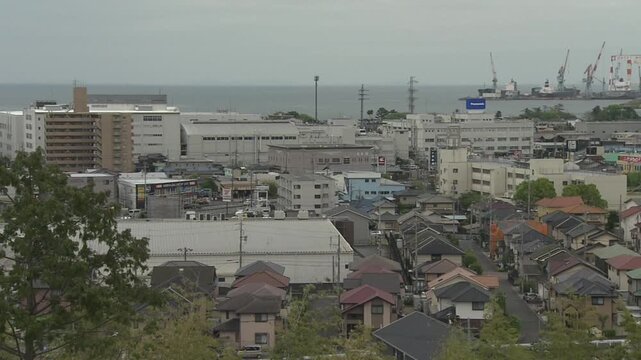 A panning shot of an aerial view of Tsu City, Mie Prefecture, moving from left to right.