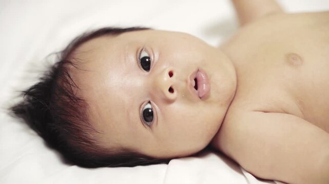 7 Weeks Old Baby Boy Closeup of Face Snorting