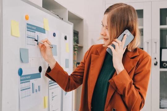 Woman smiling to herself as she works in an office