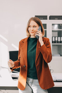 Woman smiling to herself as she works in an office