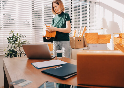 Logistics, small business woman with checklist for stock, clothes order or retail inventory management. Shipping, writing or person at ecommerce startup store for sme delivery with fashion designer