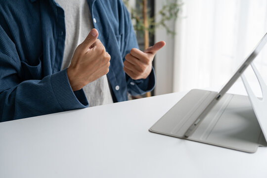 Close up of man using sign language for ASL for accessible online learning and virtual communication.