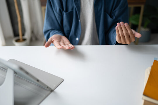 Close up of man using sign language for ASL for accessible online learning and virtual communication.