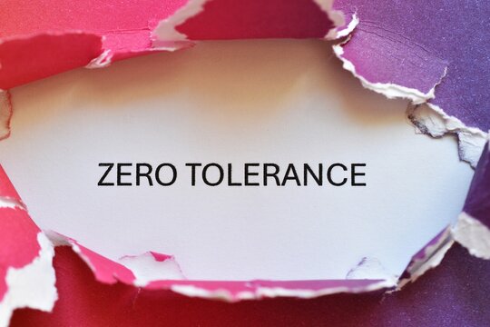 zero tolerance write on multicolored torn paper - banner 