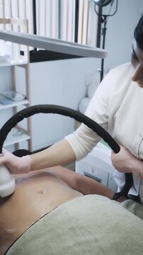 Aesthetic Practitioner Administering Ultrasound Skin Tightening on Client's Body With Precision Technique