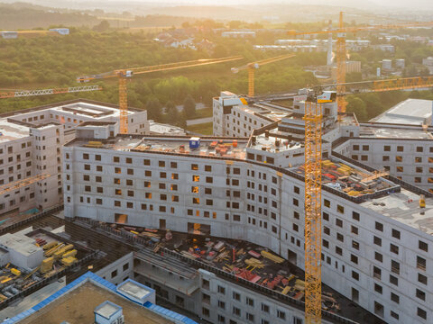Aerial view of the construction site of the new F. D. Roosevelt University Hospital with multiple tower cranes and concrete structures in Banska Bystrica, Banskobystricky kraj, Slovakia.
