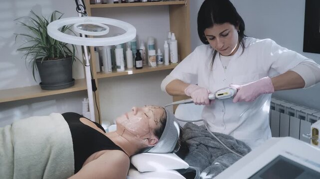 Aesthetic Professional Administering High-frequency Skin Tightening Procedure on Receptive Patient