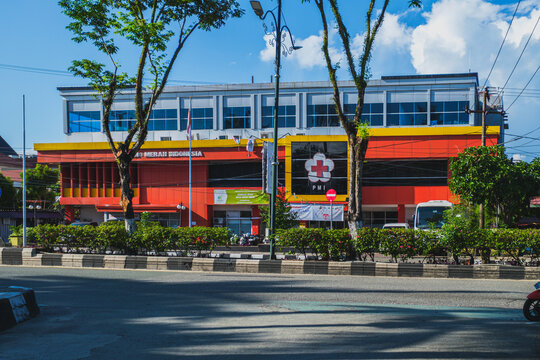 Indonesian Red Cross Society or PMI  building facade next to a city street