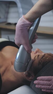 Aesthetic Specialist Administering Intensive Facial Treatment Using Handheld Ultrasound Device