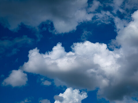 Dramatic Blue Sky Full of White Cumulus Clouds Formation Background