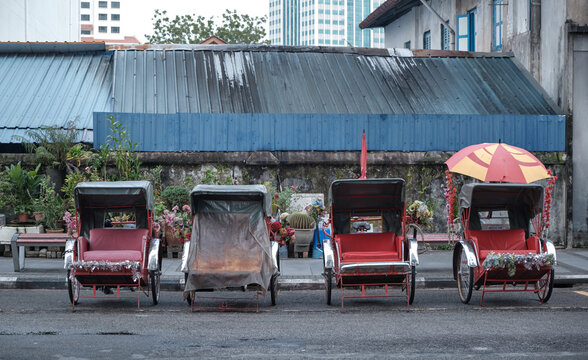 Traditional trishaws parked along a heritage street in George Town, Penang, Malaysia