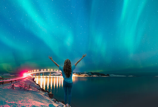 Sommaroy Bridge is a cantilever bridge connecting the islands of Kvaloya and Sommaroy with Aurora Borealis - Hillesoy Tromso Norway