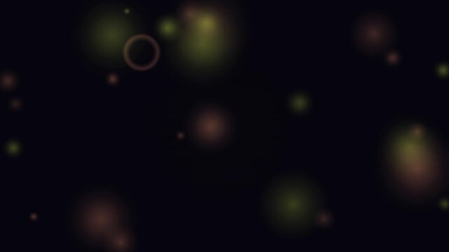 Glowing abstract circles and orbs drift smoothly in a continuous loop against a dark background.