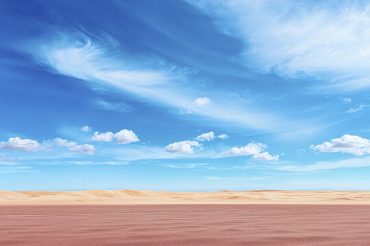 Vast desert landscape with soft sand dunes under bright blue sky filled with fluffy clouds, creating serene atmosphere