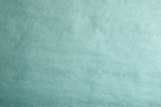Green crumpled paper material texture