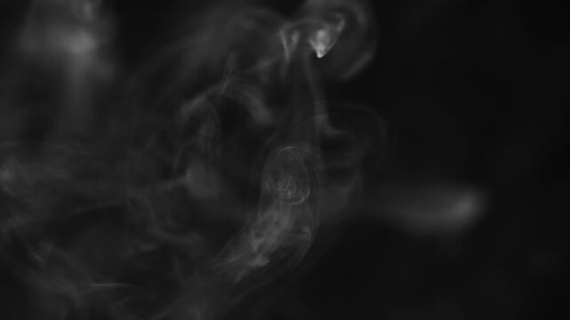 White smoke against a black background