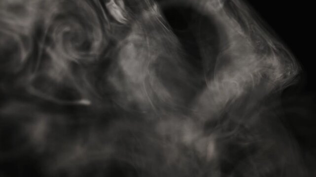Vape smoke against a black background