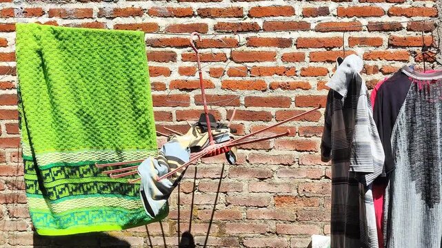 Clothes Drying On Brick Wall