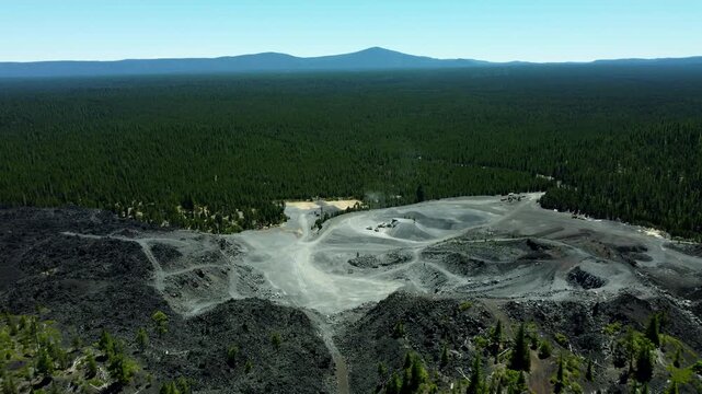 US, Oregon, Crescent, 2026-07-09 - Drone view of a volcanic rock quarry at Black Rock Butte, a lava cinder cone, in Summer
