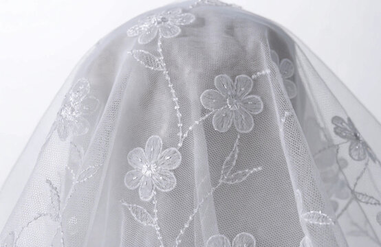 White lace background with floral embroidery pattern for wedding design