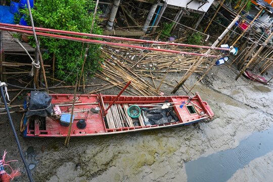 The surrounding living conditions of a small fishing village by the sea in Bang Pu District, Samut Prakan Province, Thailand, photographed on July 30, 2026.
