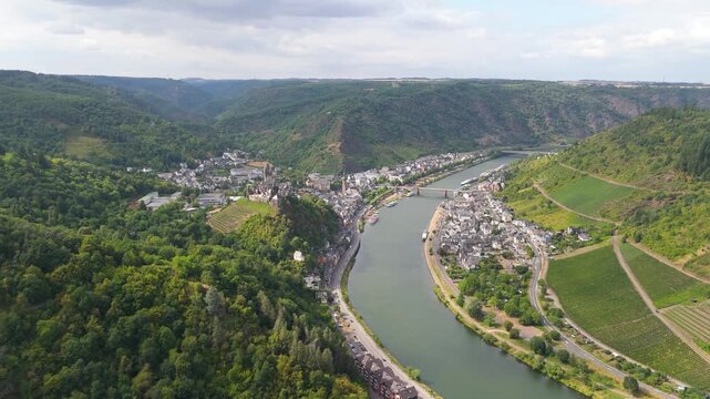Moselle valley, aerial view over Cochem, steep lush vineyards, mosel river and castle on hilltop, rhineland palatinate in Germany