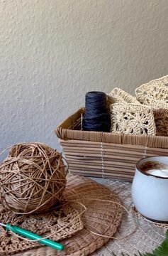 basket of yarn and crochet squares 