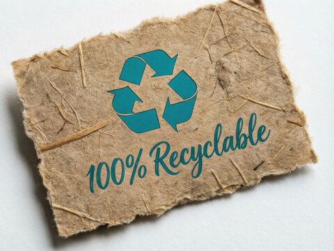 100% Recyclable text and symbol on textured brown paper