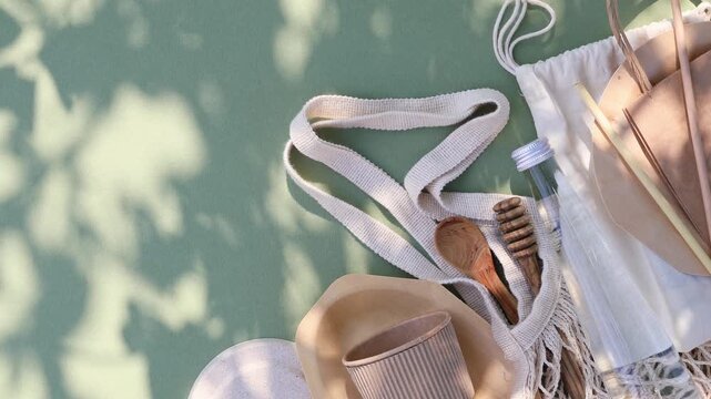 Eco conscious lifestyle arrangement with sustainable packaging, cotton bags, recycled tableware and disposable biodegradable cultery. Zero waste, eco friendly, plastic free.