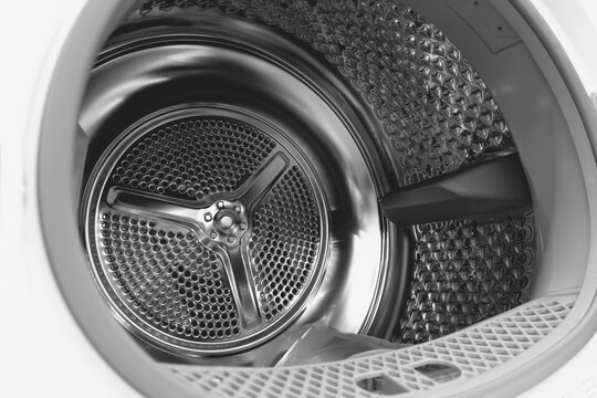 Interior view of a clean empty washing machine drum
