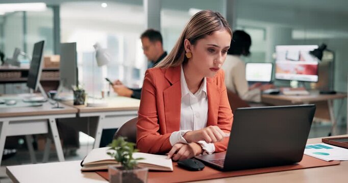 Businesswoman, laptop and writing in office with notebook, productivity data or goal setting for KPI. Coworking, person and performance analysis with computer, diary notes and time management stats.
