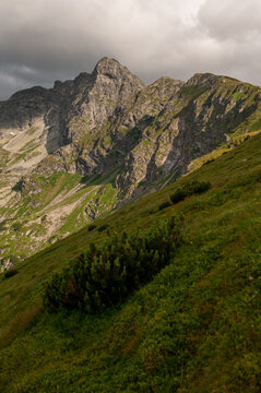 Rugged rocky mountain peak with dramatic clouds