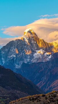 Time lapse of Siguniangshan or four girls mountains at sunset, China.