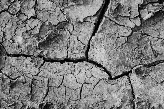 Mars like cracked ground texture background with deep fissures