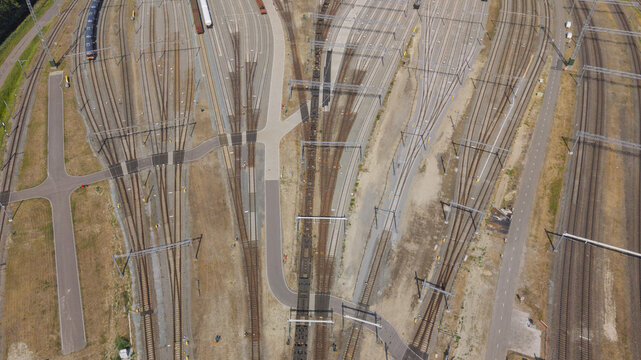 Aerial view of the Rangeerterrein rail yard featuring complex railway tracks, switches, and overhead power lines in Zwijndrecht, South Holland, Netherlands.