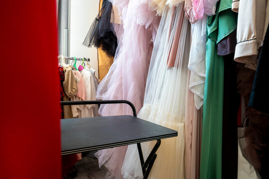 Backstage Wardrobe with Colorful Tulle and Chiffon Dresses on Hangers