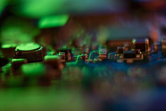 Circuit board glowing with green light representing technology