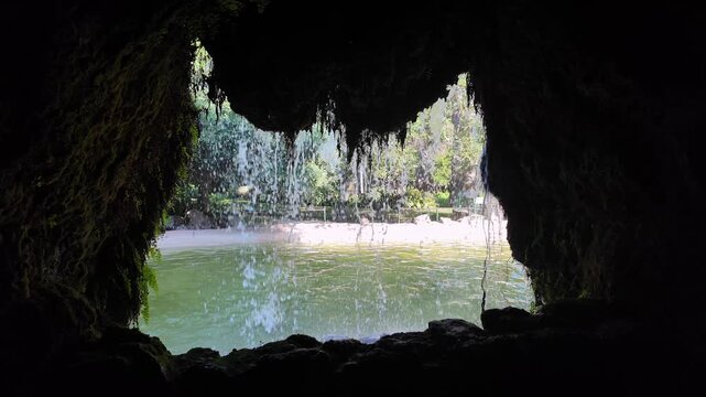 Waterfall view from cave looking towards Parque Genoves, Cadiz, Spain