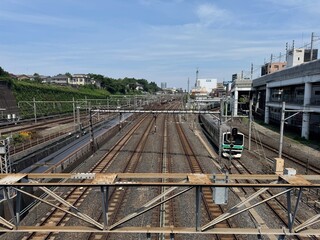 Naklejka premium Urban railway tracks and commuter train near Nippori Station in Tokyo, Japan