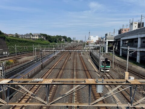 Urban railway tracks and commuter train near Nippori Station in Tokyo, Japan