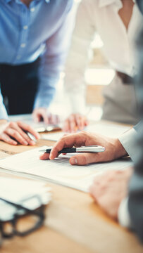 Corporate team analyzing project plan and budget