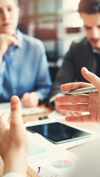 Corporate team analyzing project plan and budget