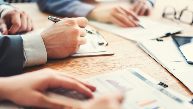 Corporate team analyzing project plan and budget