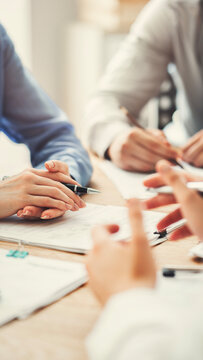Corporate team analyzing project plan and budget