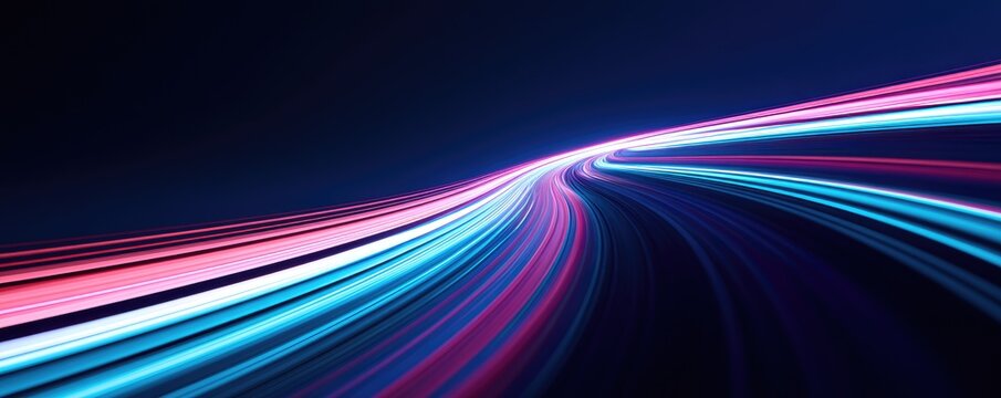 Streaks of bright pink and blue light curve and flow against a dark background