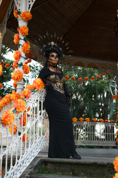 Woman Dressed as La Catrina With Skull Makeup and Marigold Flowers for Day of the Dead