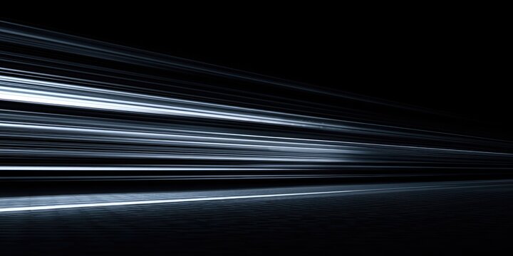 Streaking light trails suggest rapid movement through darkness