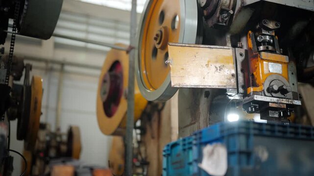 Heavy metalworking machinery operating in steel factory for metal processing, industrial manufacturing, engineering, steel production, fabrication, machining and automated factory production